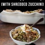 Mock apple crisp in a bowl with a spoon and a pan of more Mock apple crisp in the background.