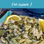 Healthy Lemon Chicken Pasta (no cream) in a bowl with lemon wedges.