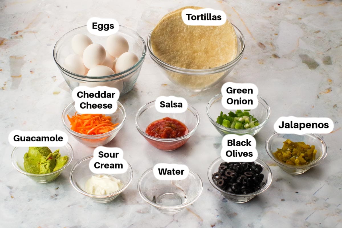 Ingredients in Mexican Baked Eggs in glass bowls, labelled.