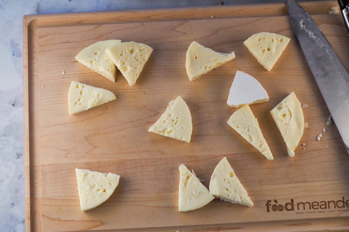 Each brie circle cut in hafl, then cut into 3 on cutting boards