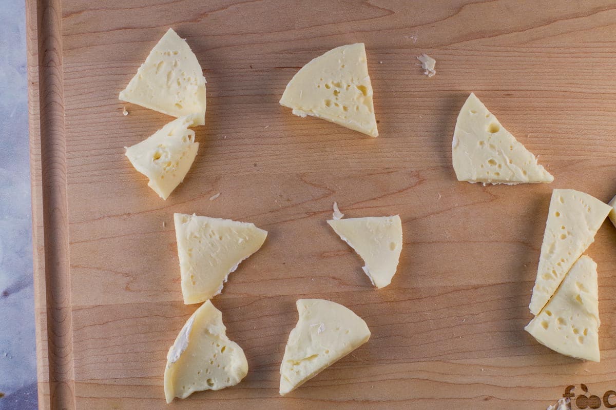 Brie cut in half width-wise.