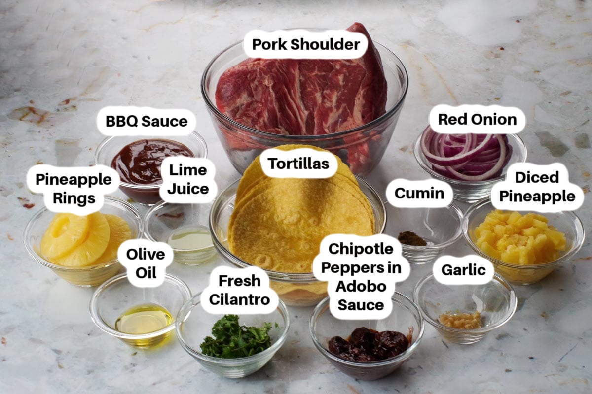 Pork Pineapple Carnitas ingredients in glass bowls, labelled.