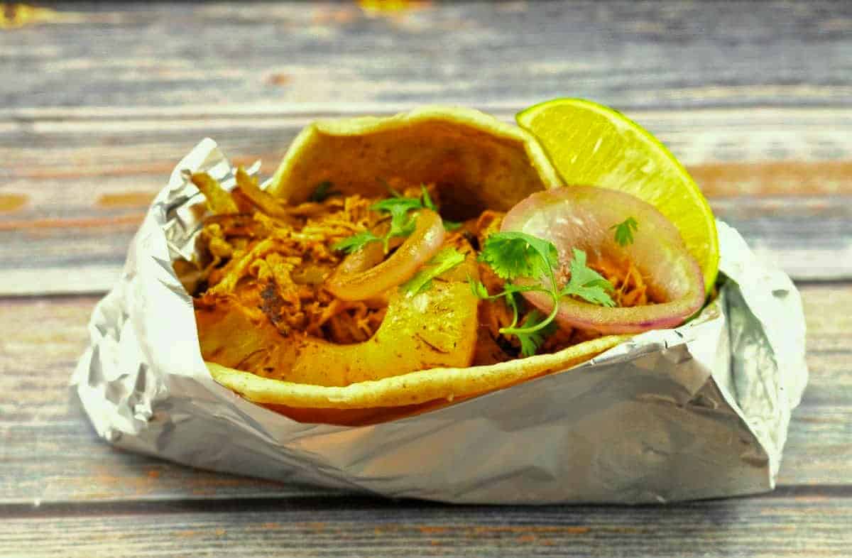 Pork Pineapple Carnita wrapped up in foil so it can be eaten on the go!