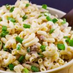 Healthy Tuna Macaroni Salad without peas in a bowl with a serving spoon.