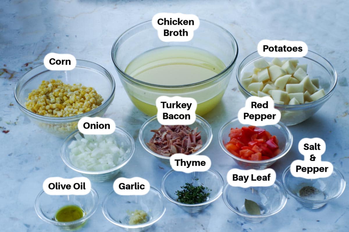 Ingredients in Healthy Corn Chowder Soup in glass bowls, labelled.