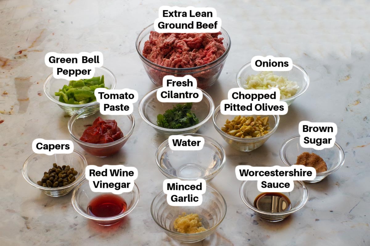 Healthy Picadillo ingredients in glass bowls, labelled.