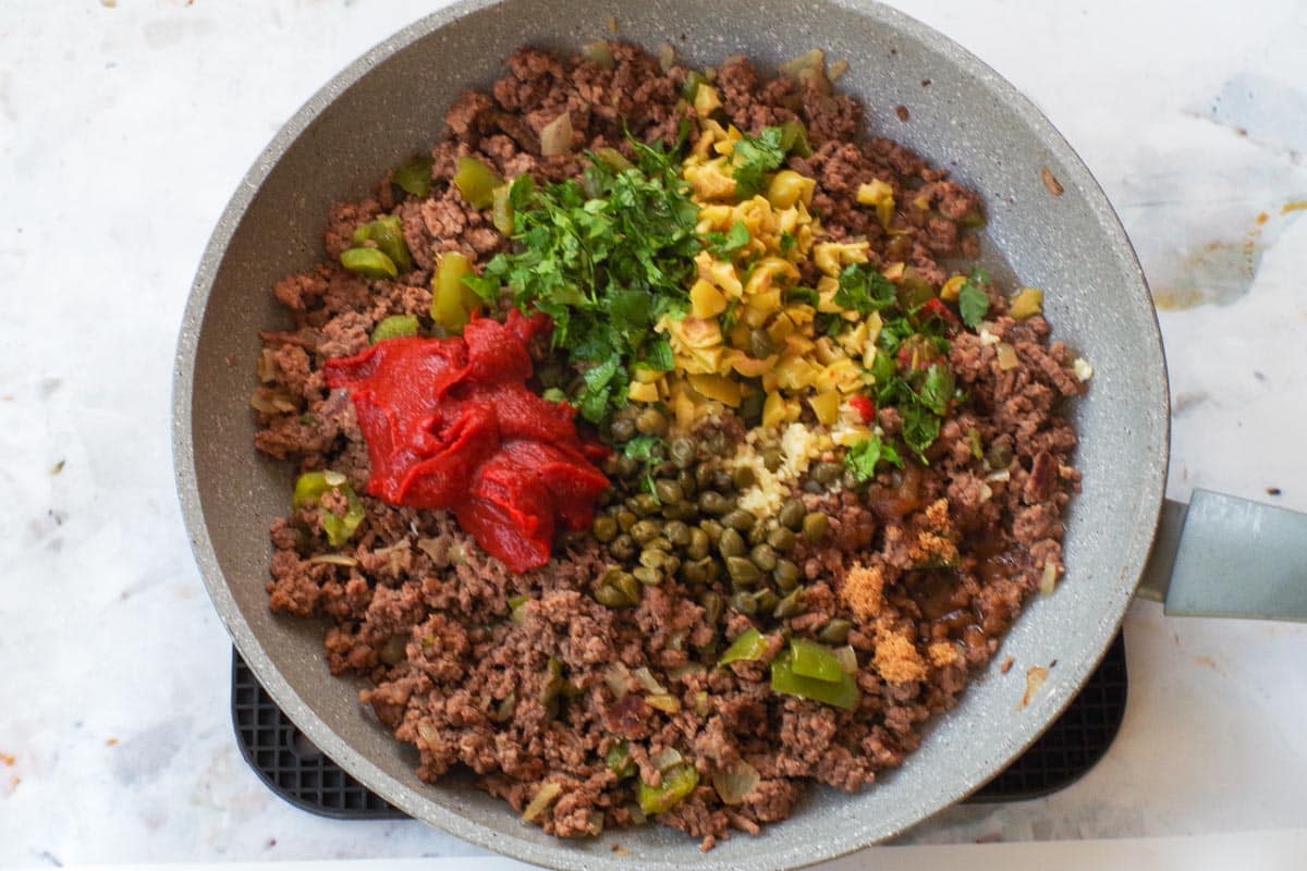 Cooked ground beef mixtture with remaining ingredients added.