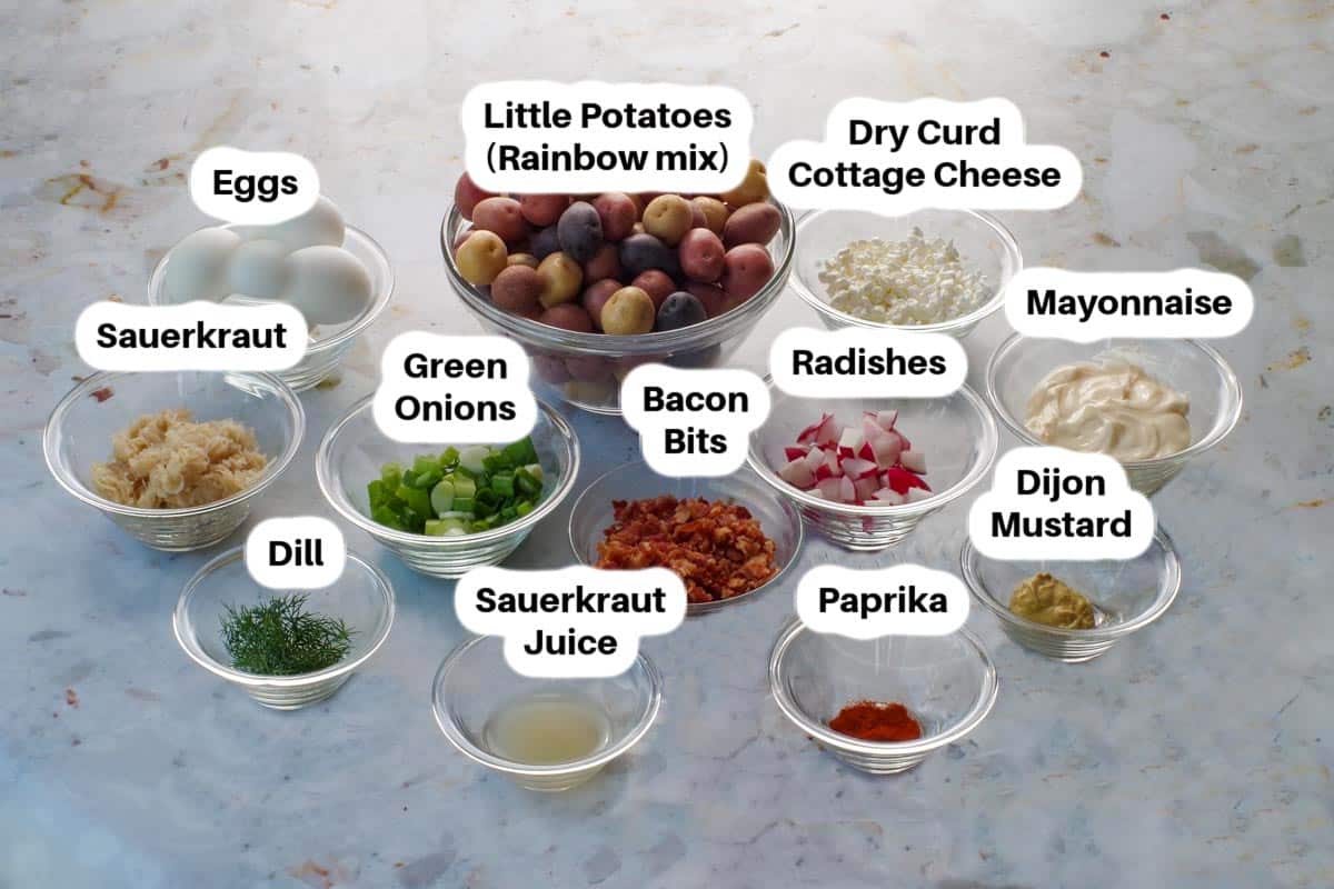 Ingredients in Pierogi Potato salad, in glass bowls, labelled.