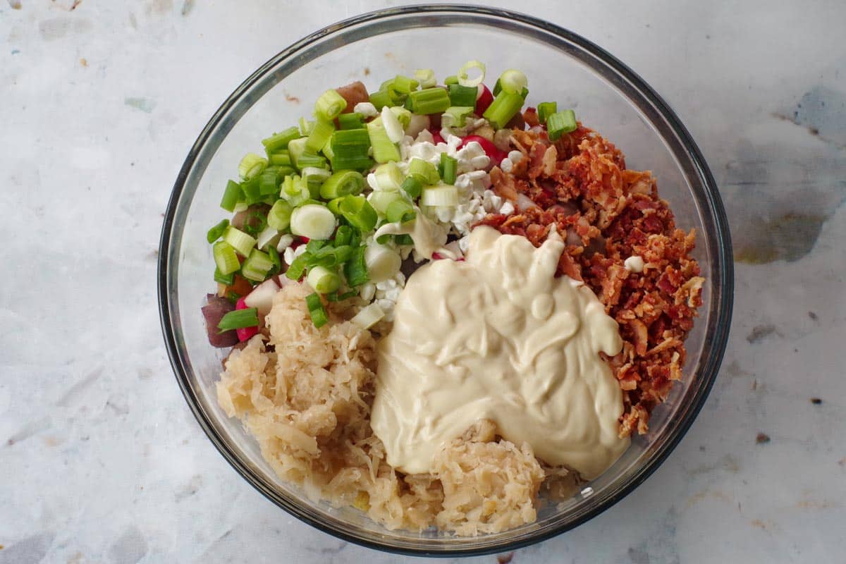 Remaining ingredients added to bowl with potatoes.