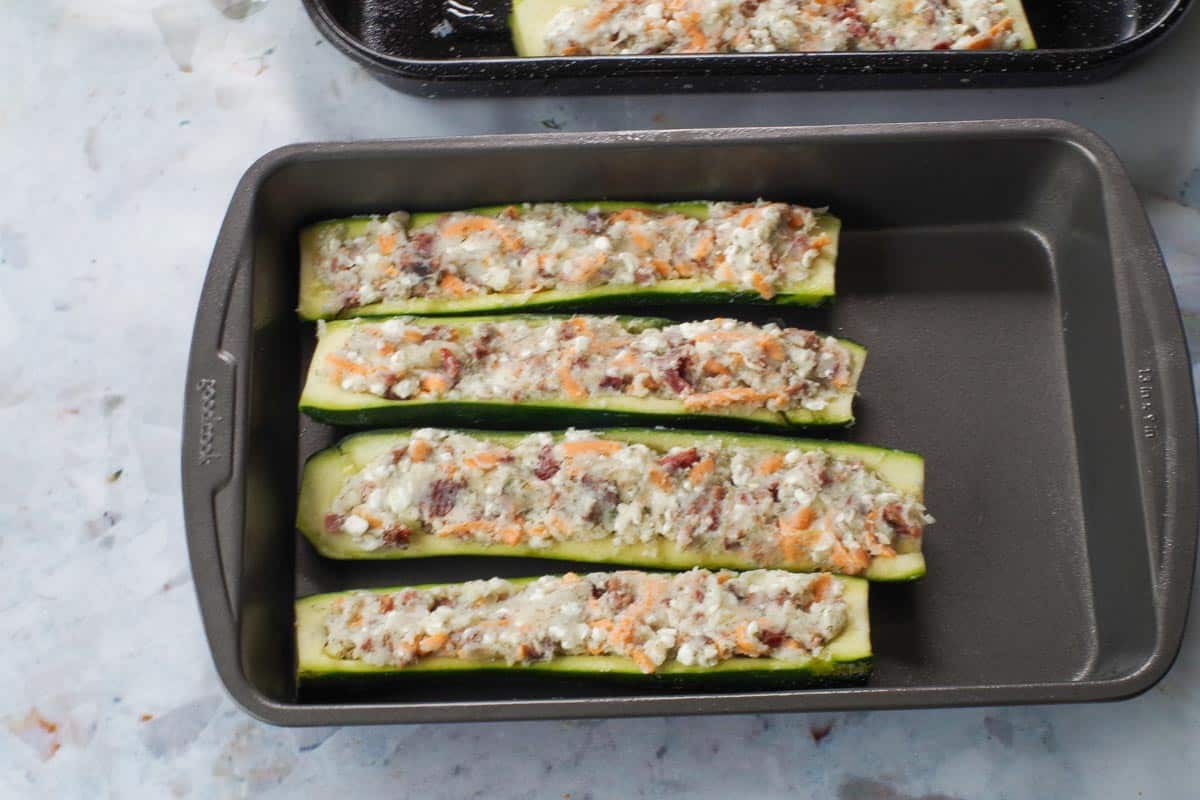 Pierogi filling stuffed into zucchini and flattened with a spoon.