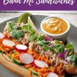 open faced Vietnamese Chicken Banh Mi Sandwich on a plate with a small dish of sriracha sauce.