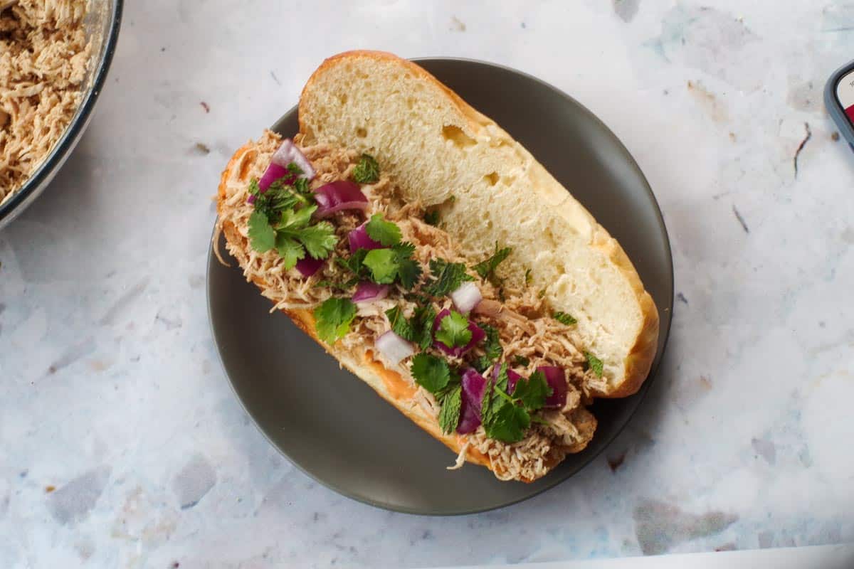 Shredded chicken, mint, cilantor and red onion on sriracha mayo.