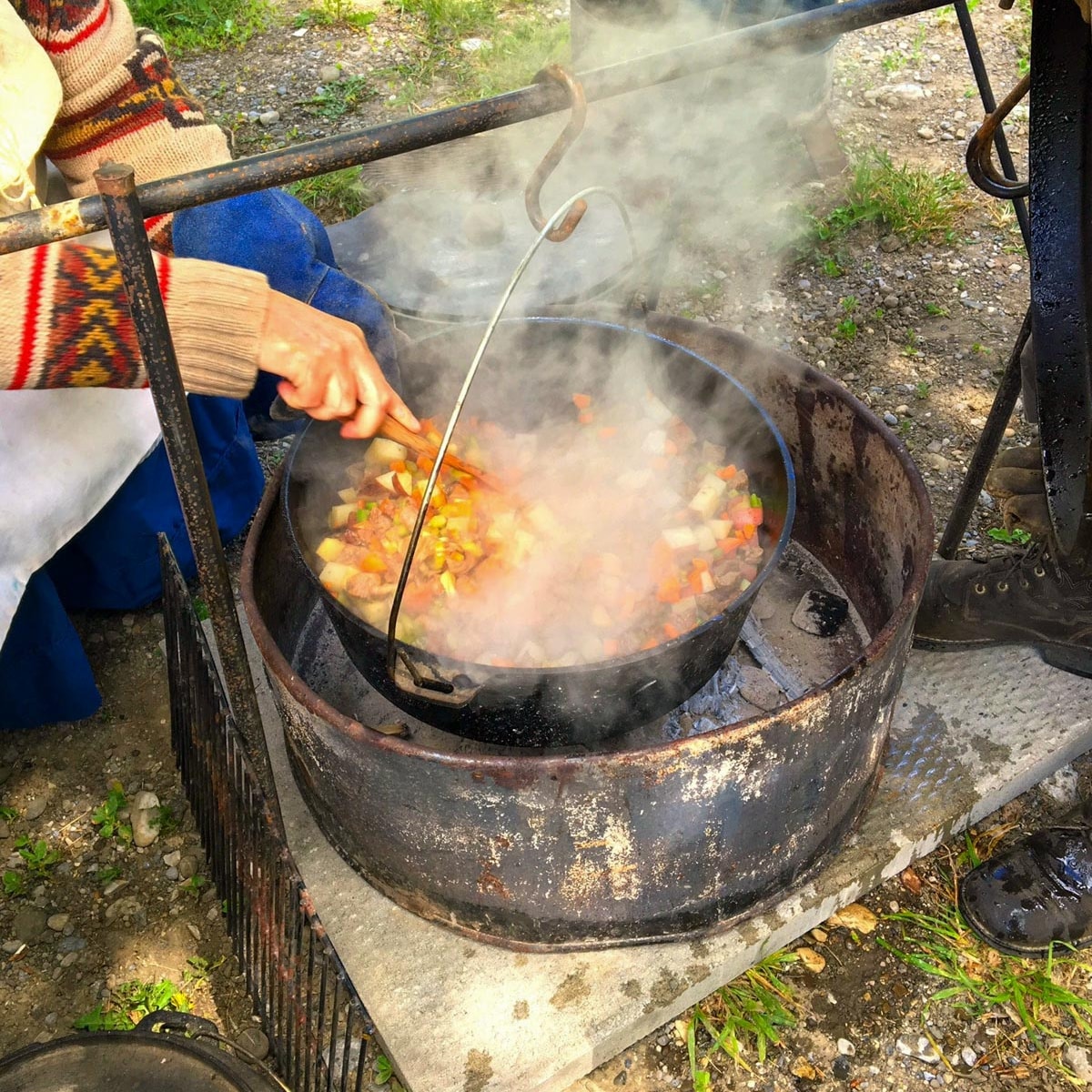 stew being made over open fire at Bar U Ranch stew cook-off