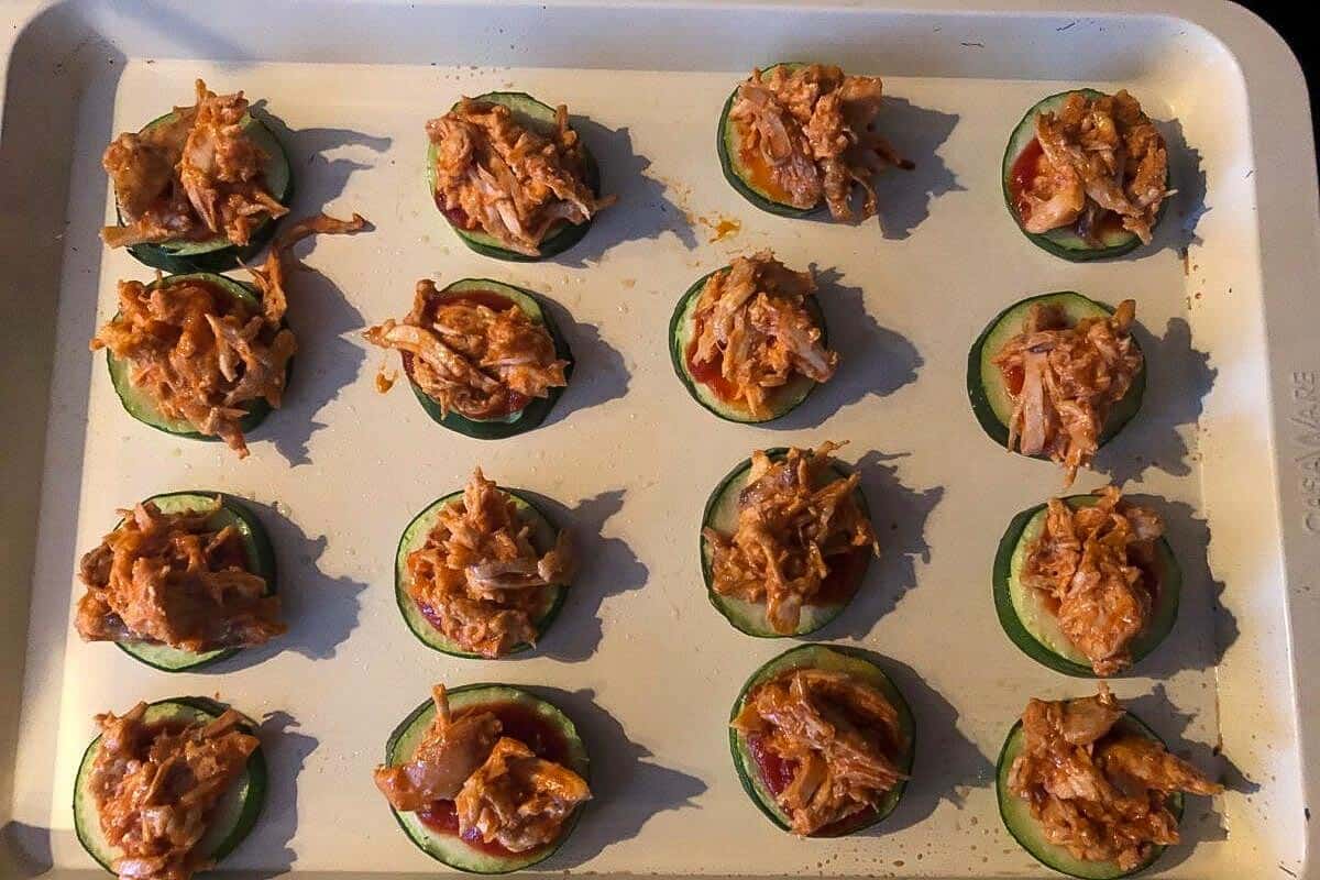 Zucchini bites with pizza sauce and buffalo chicken.