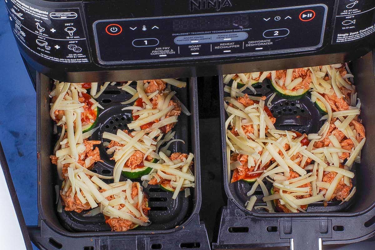 Mozzarella Cheese sprinkled over buffalo chicken.