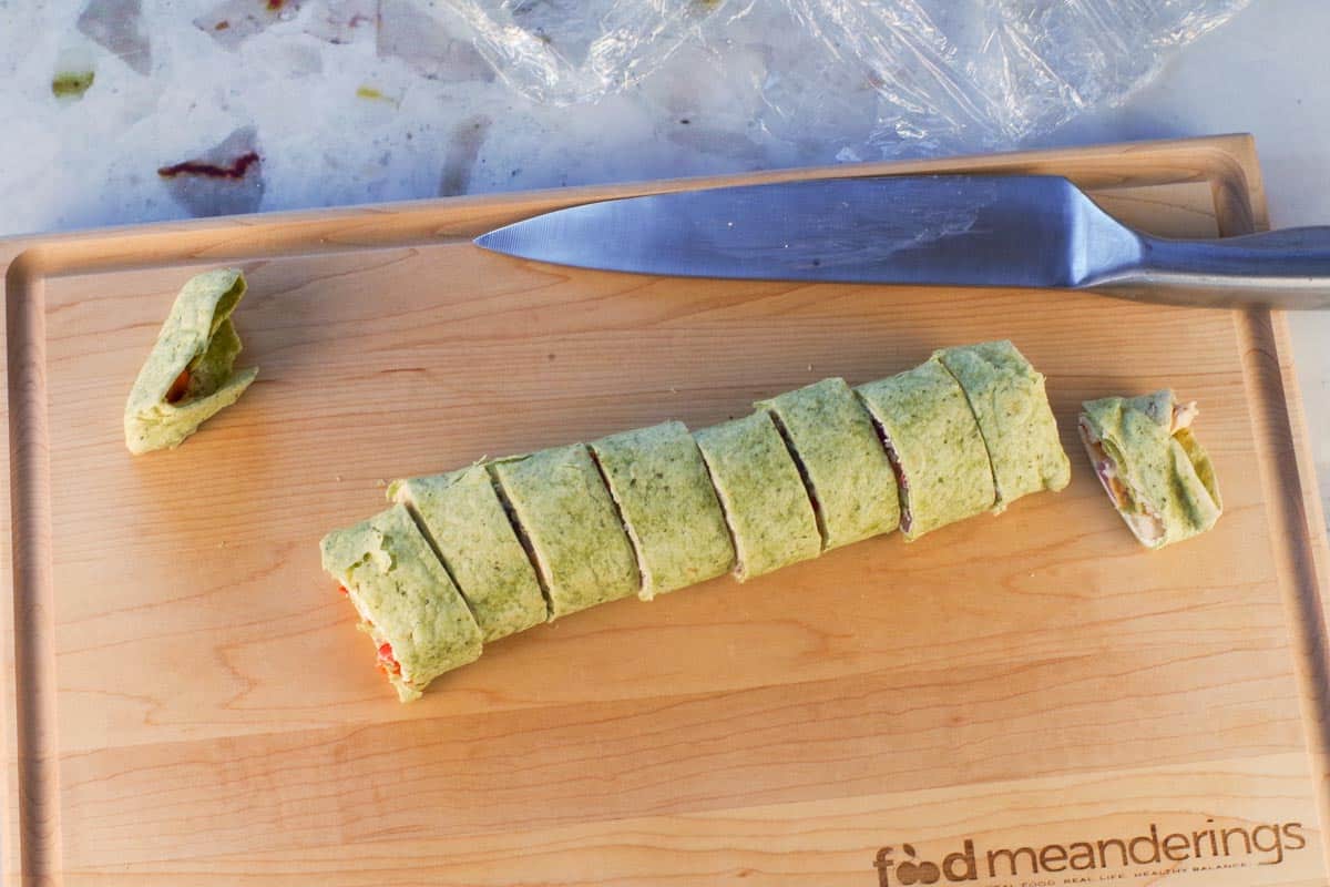 Ends cut off tortilla and tortilla cut into equal sized pieces.
