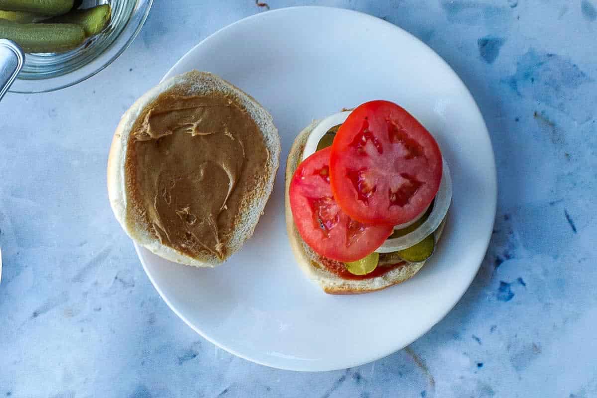 Peanut butter added to the inside of the top of the bun.