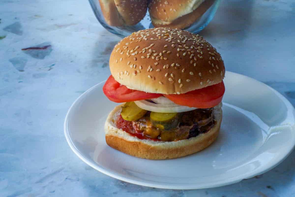 Peanut butter burger on a white plate