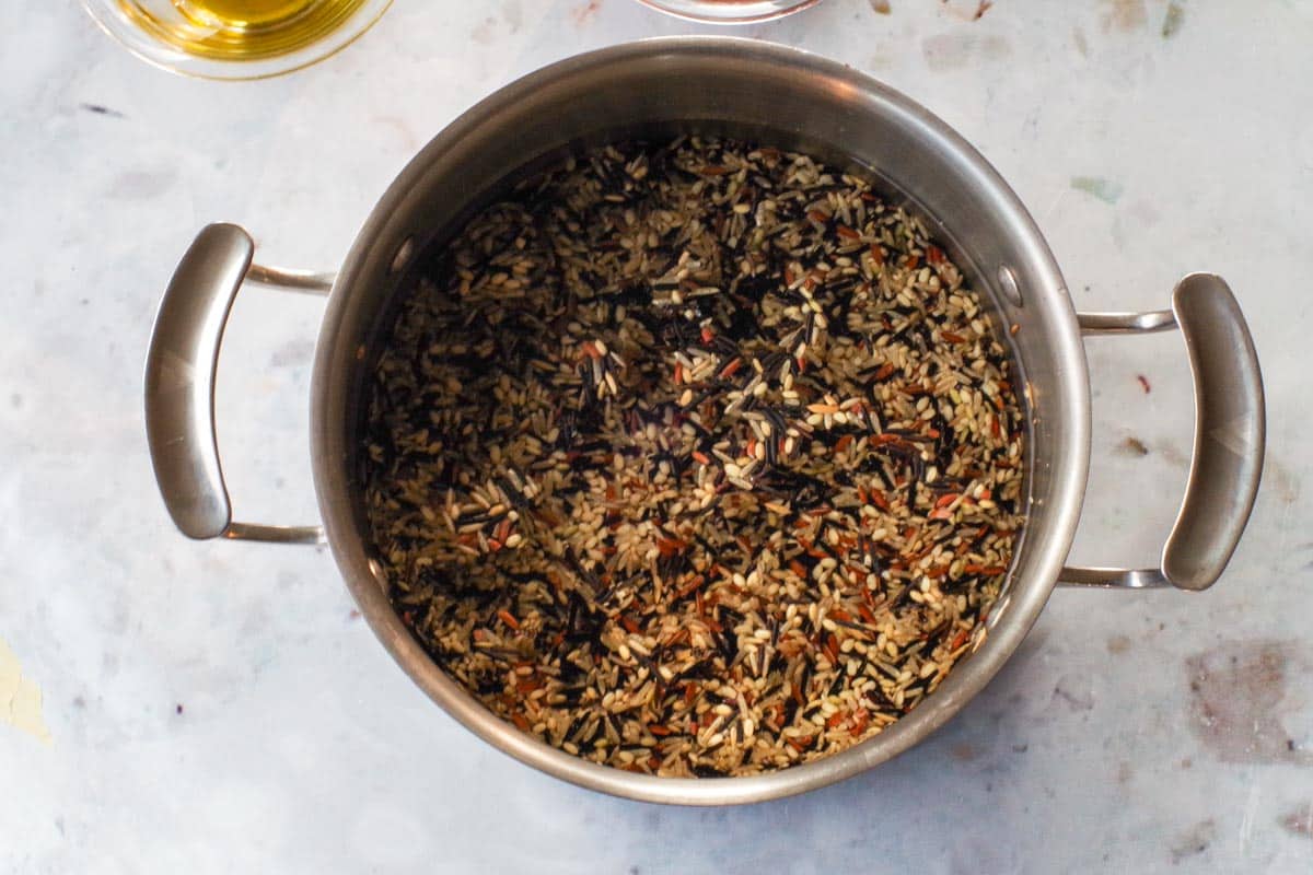 Wild and Brown Rice Medley being cooked in a medium pot.