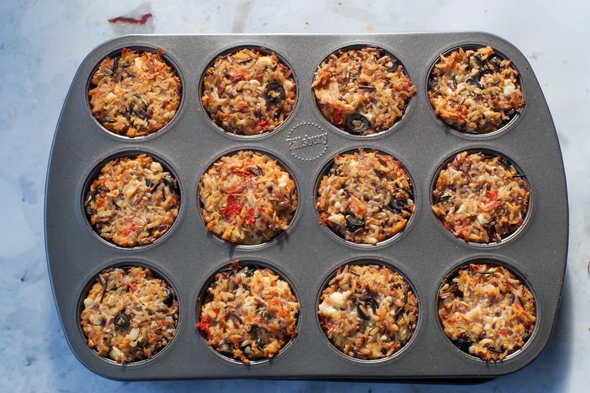 Cooked rice cups in muffin tin.