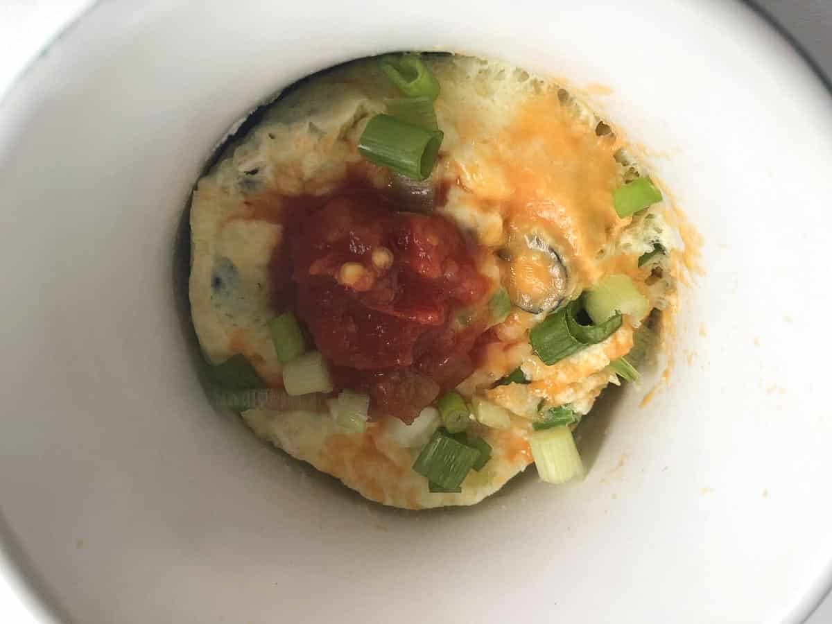 Microwave Omelette in a Mug garnished with salsa.