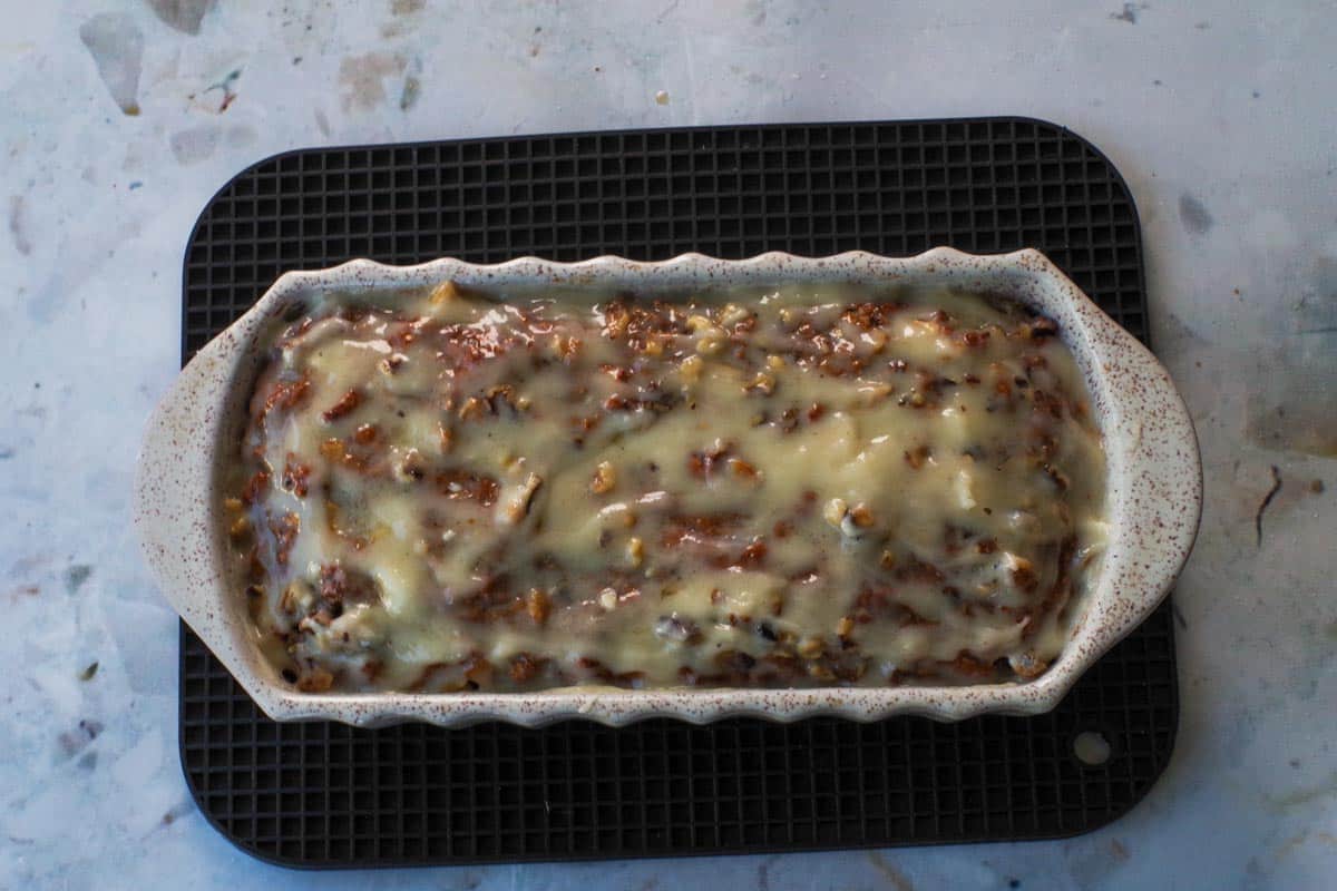 Glaze poured over loaf in loaf pan.