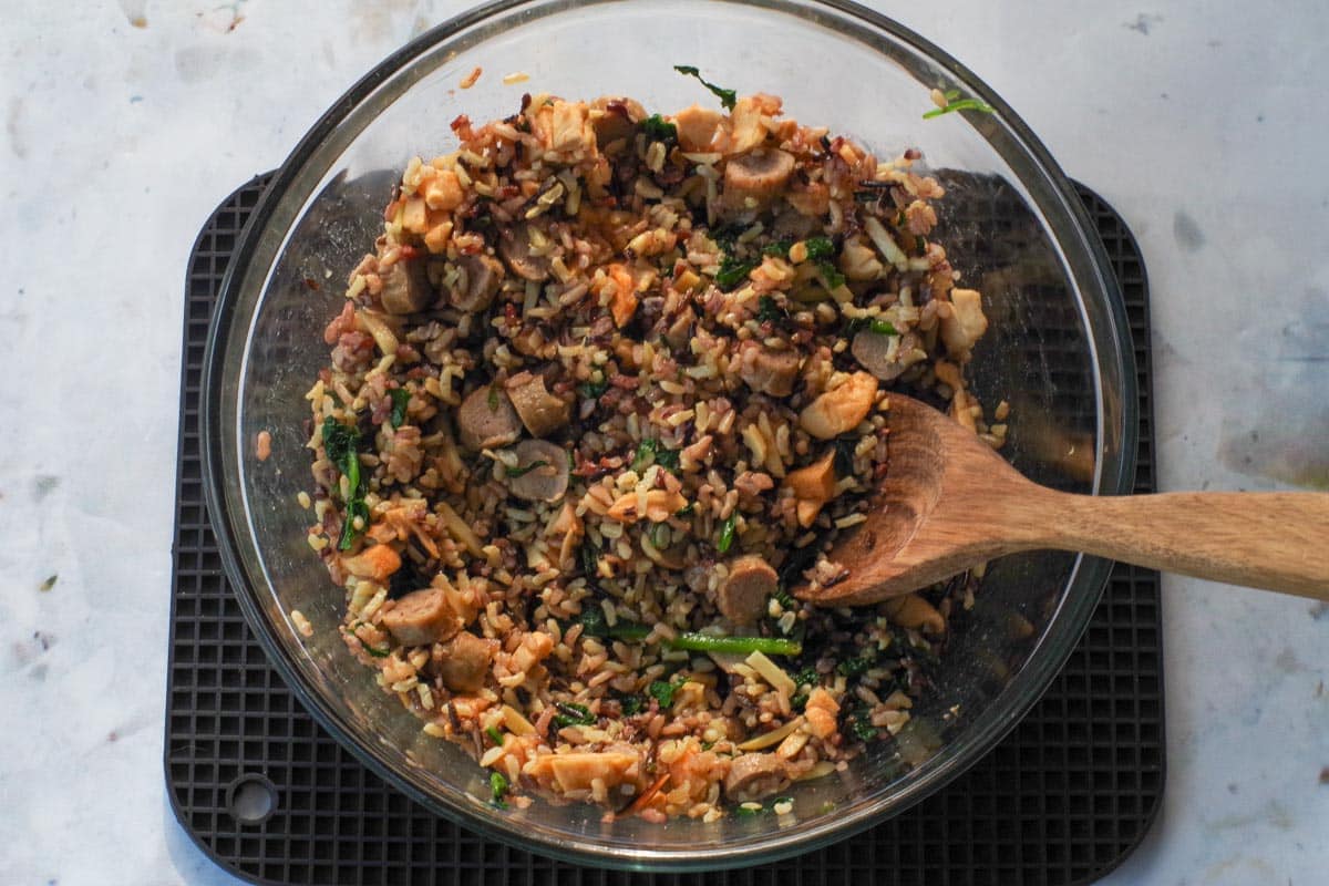 Dried apples and sausage mixed into rice.