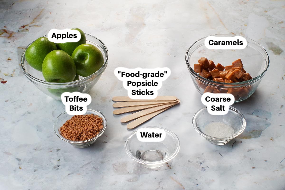 Ingredients in Salted Toffee Halloween Caramel Apples in glass bowls, labelled.
