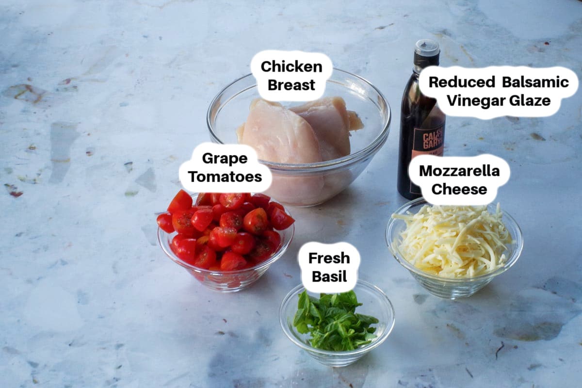 Ingredients in Sheet Pan Caprese Chicken ingredients in glass bowls, labelled.