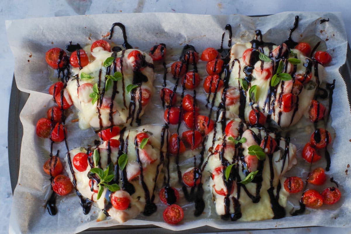 Chicken Caprese with Balsamic Vinegar drizzled over it.