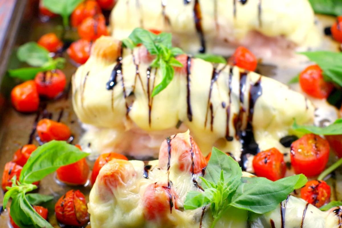 Sheet Pan Chicken Caprese baked, on a sheet pan.