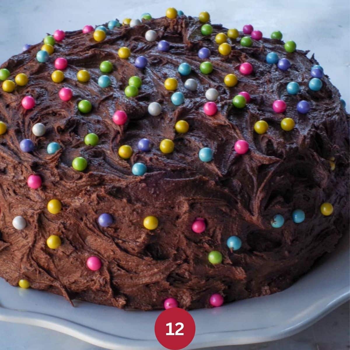 Chocolate Mayonnaise cake frosted and decorated with celebration pearls.