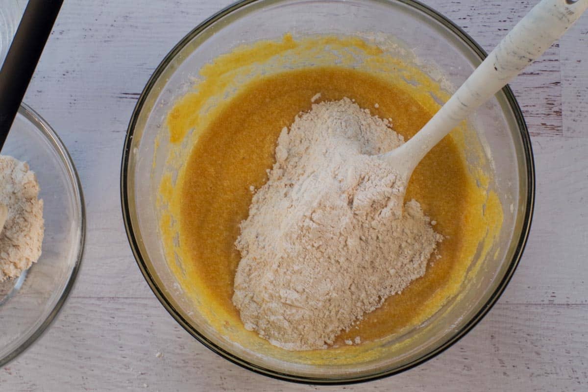 Dry ingredients added to batter alternately with water in large glass bowl.