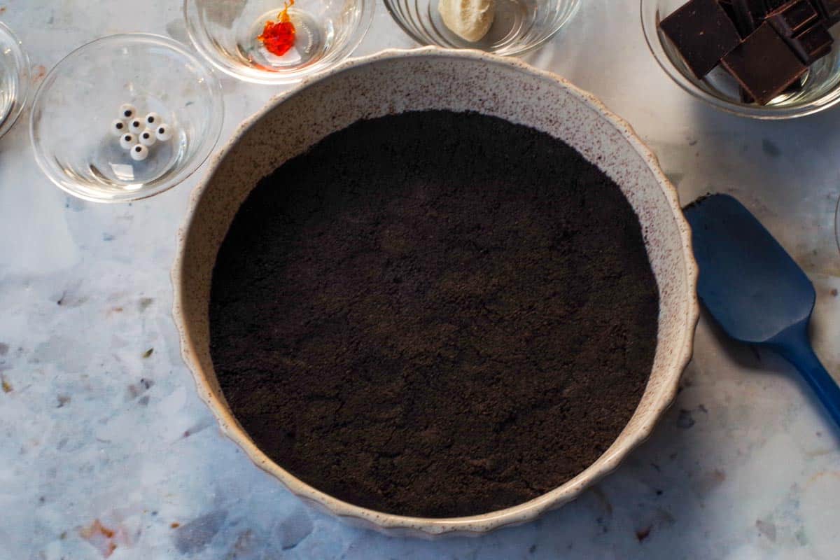 Chocolate mixture pressed into buy of pan.