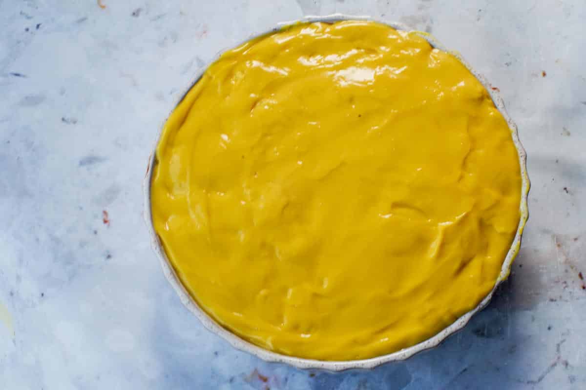 Yellow vanilla pudding on top of cake layer.