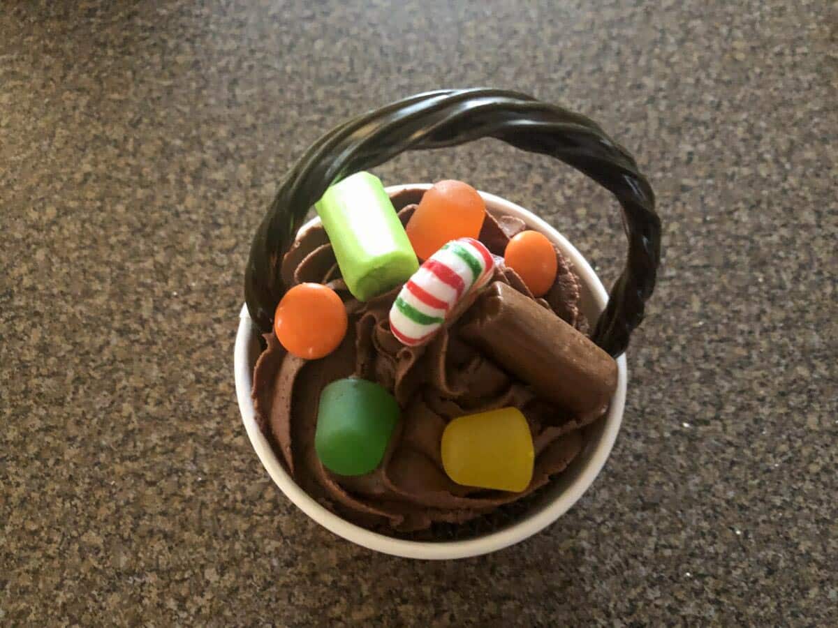 Candies on Jack o latern cupcakes.