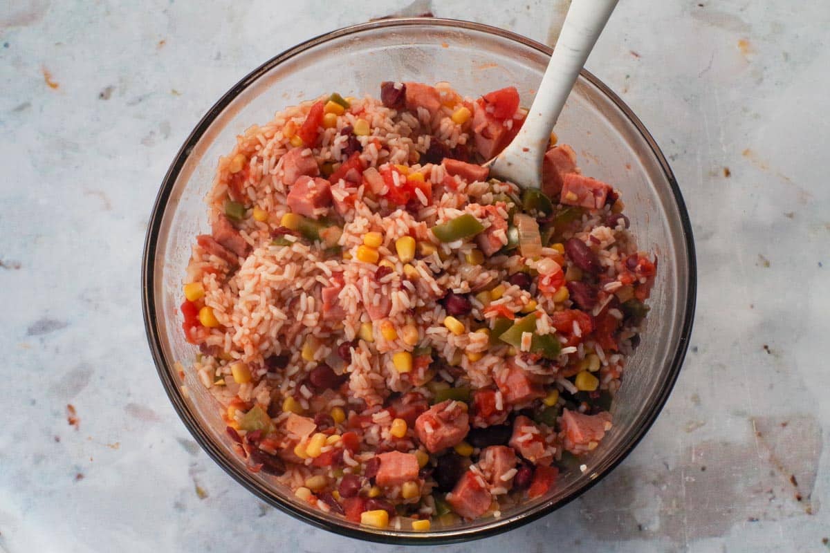 ham mixture mixed with rice in a large glass bowl.