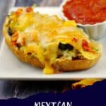 Mexican Tuna Melt on a white plate with a dish of salsa.