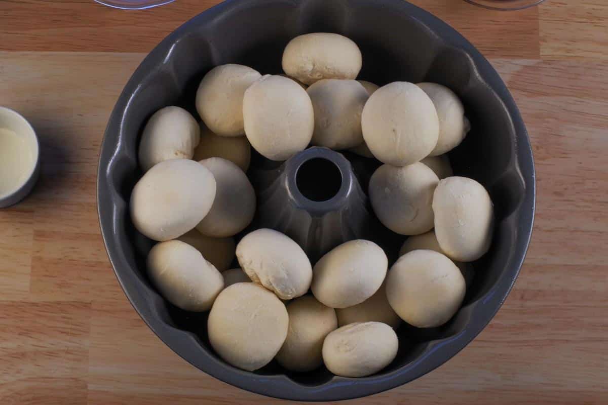 Frozen dinner rolls in a bundt pan.