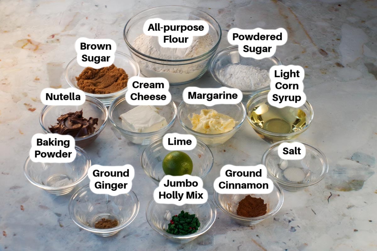 Ingredients in Gingerbread Yule Log Cookies in glass bowls, labelled.