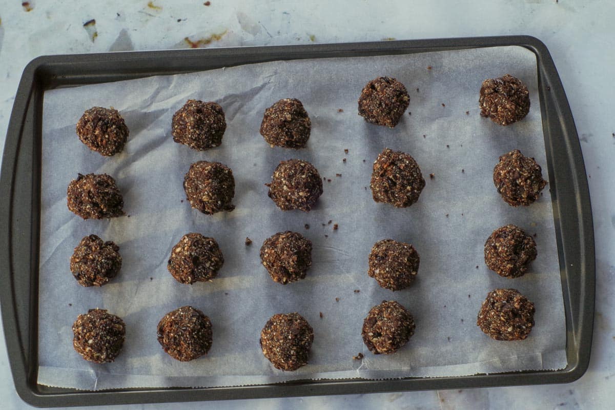 Mixture formed into balls and placed on a parchment covered cookie sheet.