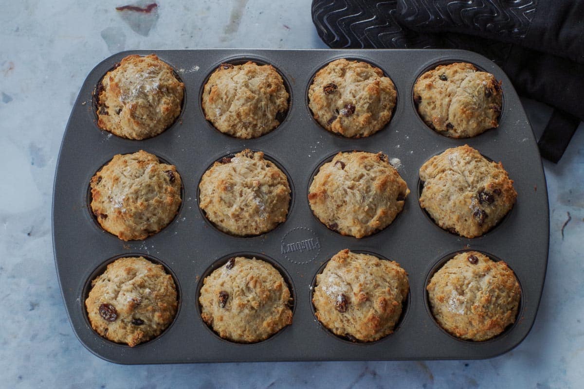 Baked healthy Irish Soda bread muffins in a muffin  tin.