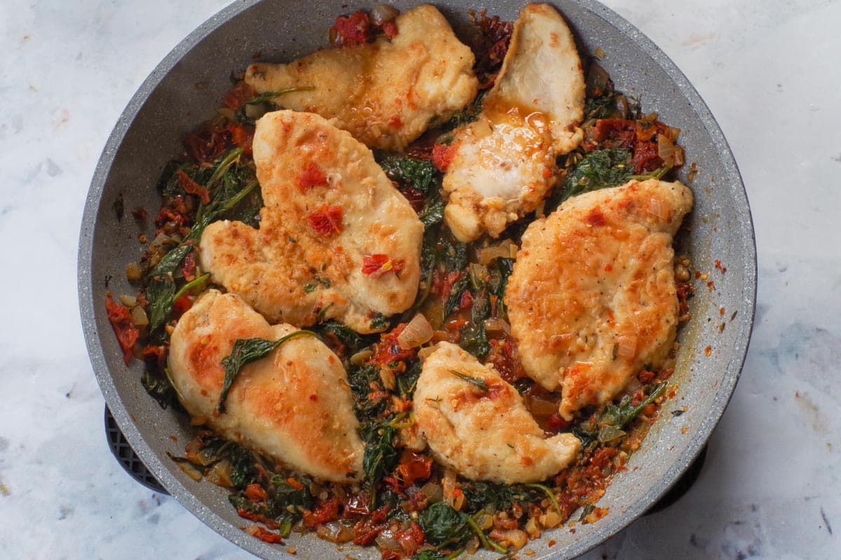 Cooked Marry Me Chicken in a pan,