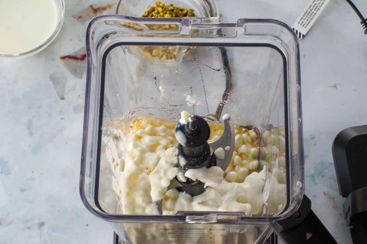 Cottage cheese, instant pudding mix, Greek yogurt and light cream cheese in blender.