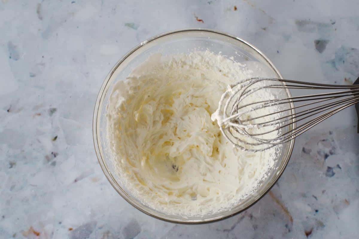 Whipping cream whipped to stiff peaks.