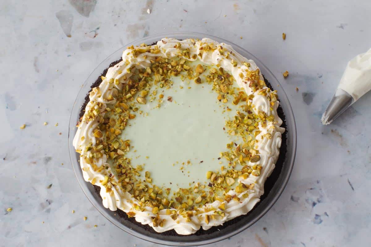 Pie with whipped cream border and p