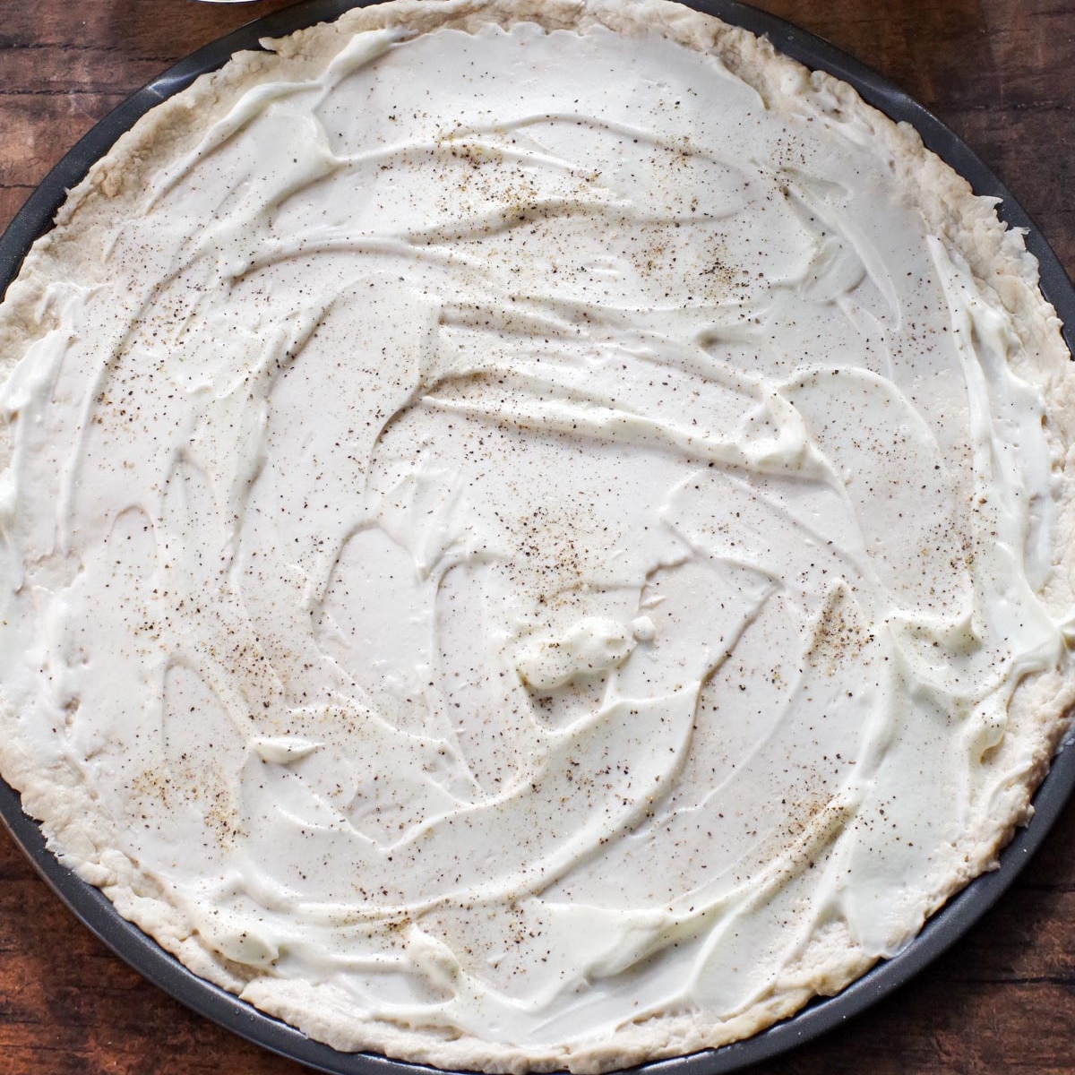 Sour cream added to pizza dough.