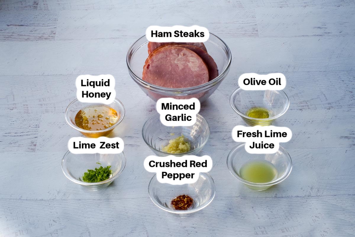 Ingredients in Air Fryer Honey Lime Ham Steaks in glass bowls, labelled.