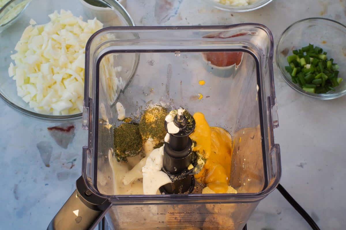 Egg yolks, half the cottage cheese and salt, pepper, pickle juice, sugar and lemon juice in blender.