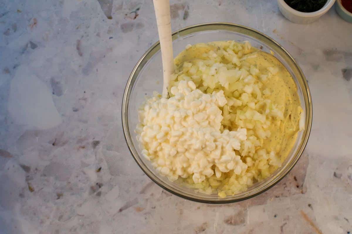 Egg yolk mixture, onion, remaining cottage cheese and egg whites in a medium glass bowl.